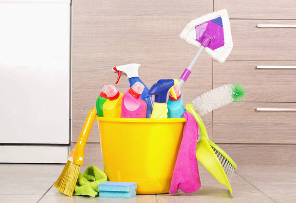 Cleaning products in bucket in kitchen - Photo, Image