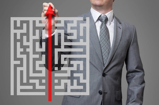 Businessman finding the solution of a maze - Photo, Image