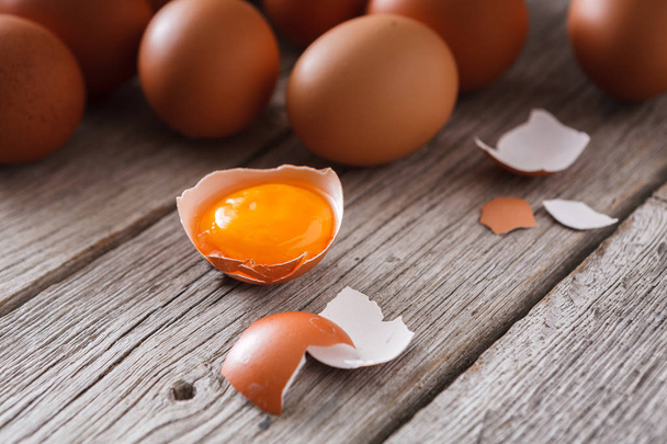 Fresh chicken brown eggs on rustic wood, organic farming concept background - Photo, image