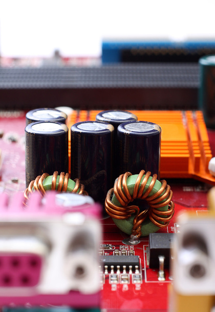 Capacitors and electronic components mounted on a motherboard - Photo, Image