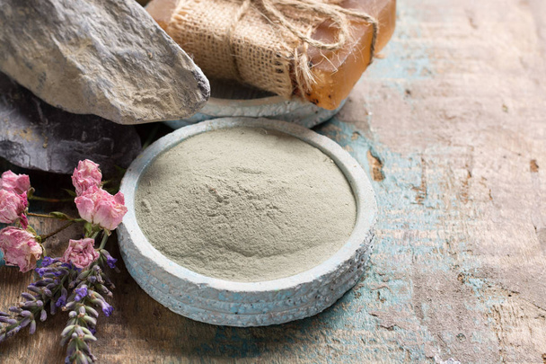 Nature cosmetics, handmade preparation with essential oils and ancient minerals of creams, soaps, skincare masks, scrubs from fresh and dried lavender and roses flowers, green clay powder - Photo, Image