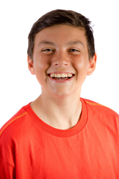 Young teenage boy isolated on white smiling - Фото, изображение