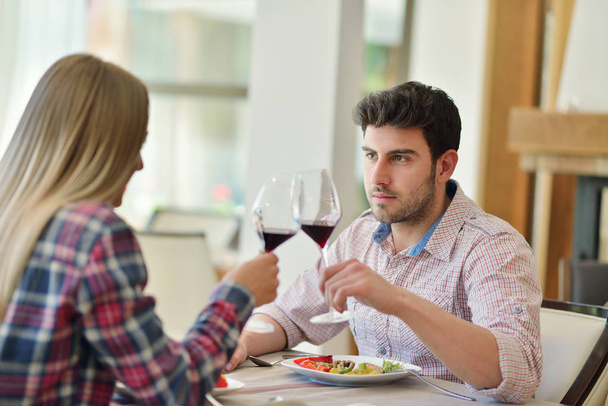 romantic lunch in a fancy restaurant.couple sitting and eating at lunch time - Photo, Image