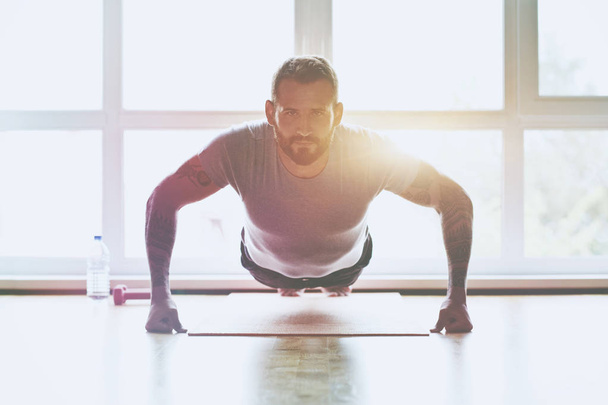 sporty man doing push-up  exercise - Fotó, kép