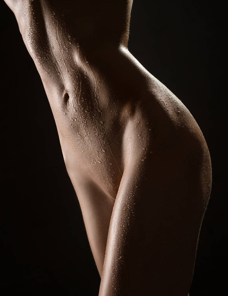 Cropped image of slim tanned body isolated shot - Foto, imagen