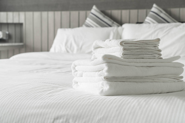 White towel on bed decoration in bedroom interior  - Zdjęcie, obraz