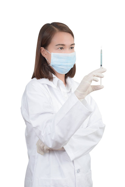 Жінка лікар тримає медичний ін'єкційний шприц
 - Фото, зображення
