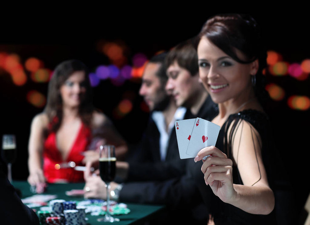 Group of an elegant people playing poker at the gambling house - Fotoğraf, Görsel