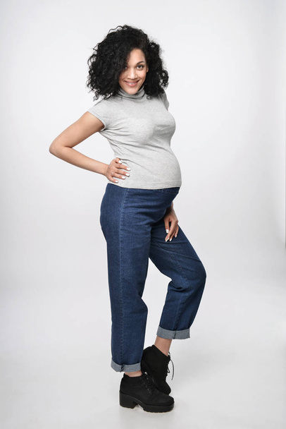 Pregnant woman standing in full length - Photo, Image