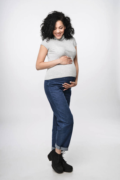 Pregnant woman standing in full length - Φωτογραφία, εικόνα