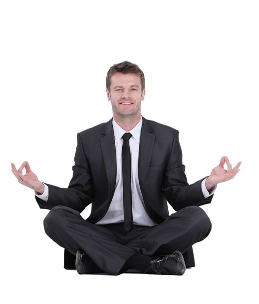 Closeup of attractive young man meditating isolated on white - Foto, imagen