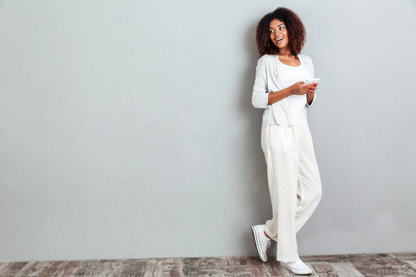 Full length portrait of young casual afro american woman - Photo, Image