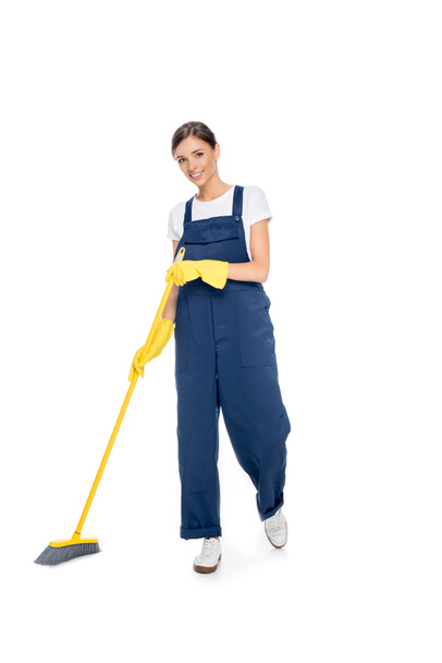 smiling cleaner in uniform with broom - Foto, Imagen