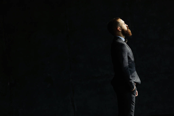 Portrait of handsome stylish man in black suit and bow-tie - Φωτογραφία, εικόνα