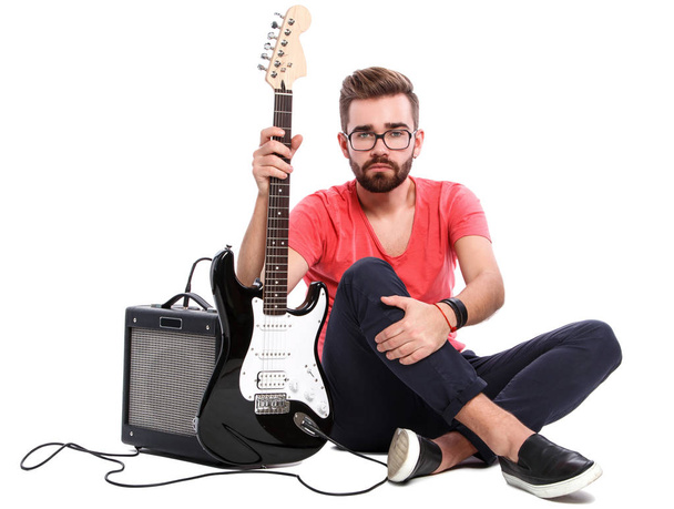 Stylish guy with a guitar - Foto, Imagen