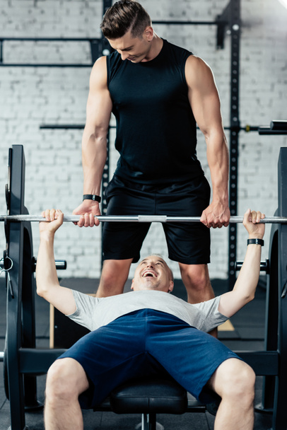 senior sportsman lifting barbell - Фото, изображение