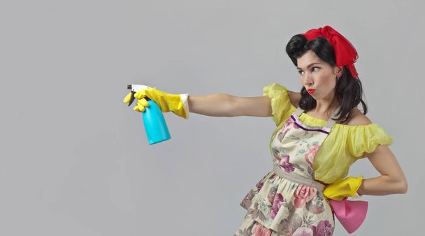 Beautiful woman with cleaning accessory . - Foto, afbeelding