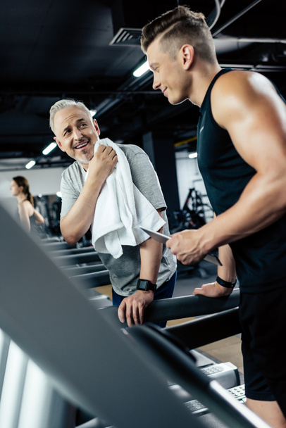sportsmen training on treadmills - Fotoğraf, Görsel