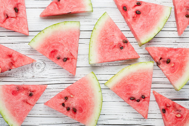 watermelon slices on white wooden background top view - Φωτογραφία, εικόνα