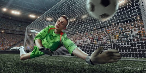 Goalkeeper tries to hit the ball - Photo, Image
