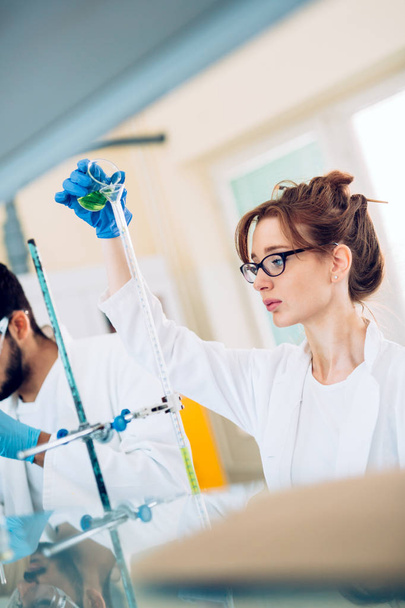Attractive student of chemistry working in laboratory - Fotografie, Obrázek