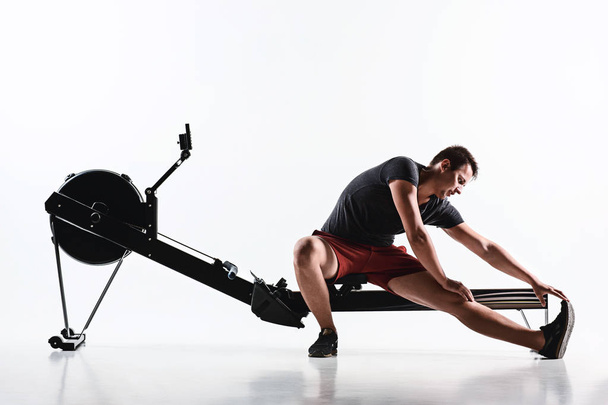 Man Using A Press Machine In A Fitness Club. - Фото, изображение