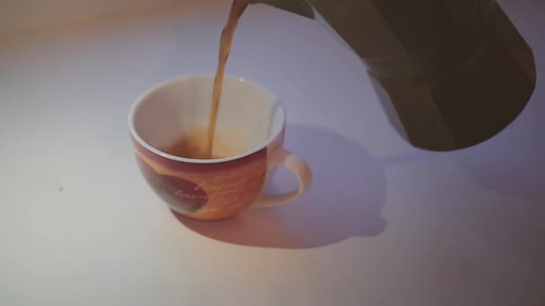 Spilling coffee into a cup - Filmati, video