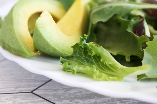salad with avocado on the plate - Φωτογραφία, εικόνα