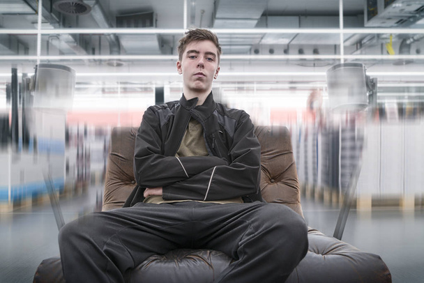 surround sound, young man on a leather armchair - Photo, Image