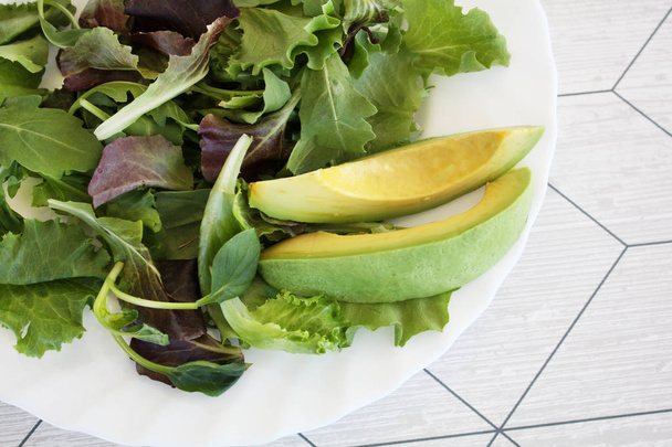 salad with avocadoon the white plate - Φωτογραφία, εικόνα