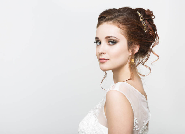 Young pretty caucasian bride in wedding dress - Fotó, kép