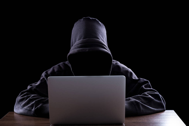 Anonymous hacker in the dark - Foto, afbeelding