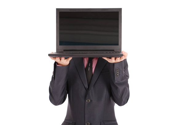 Homme en costume noir avec un ordinateur portable
 - Photo, image