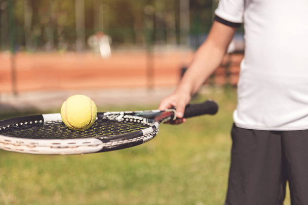 Boy keeping professional sport racquet - Fotoğraf, Görsel