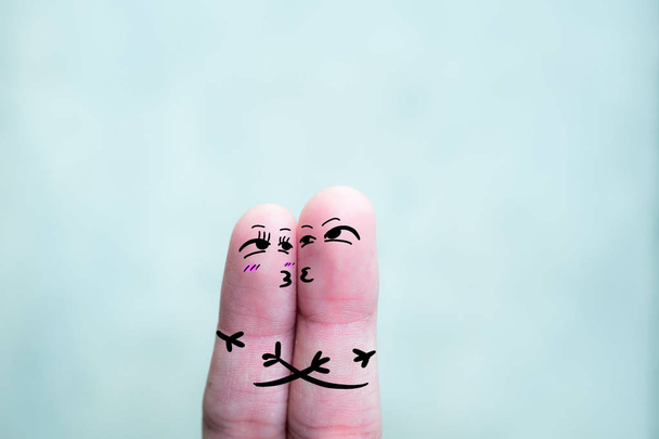 A happy couple in love with painted smiley and hugging - Fotoğraf, Görsel