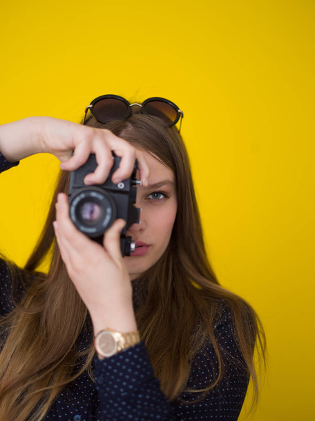 young girl taking photo on a retro camera - Фото, изображение