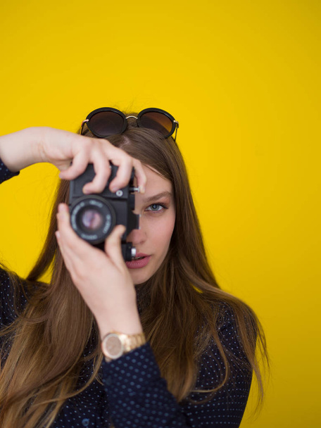 young girl taking photo on a retro camera - Фото, изображение