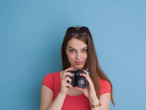 beautiful girl taking photo on a retro camera - Fotoğraf, Görsel