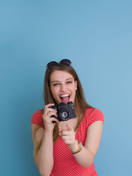 beautiful girl taking photo on a retro camera - Фото, изображение