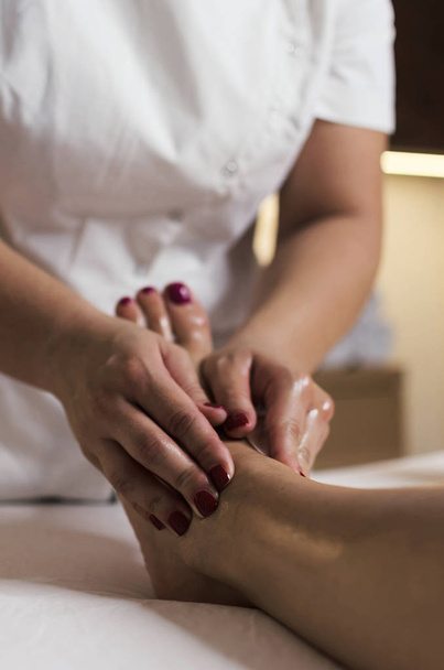 Woman having massage in s salon - Fotó, kép