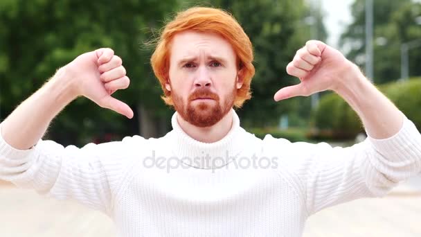 Thumbs Down with Both Hands by Man with Red Hairs, Outdoor - Footage, Video