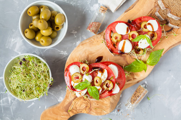 sandwiches with mozzarella, tomatoes and olives - Φωτογραφία, εικόνα