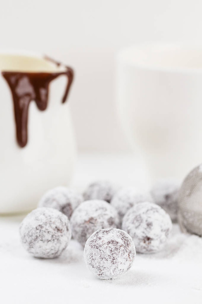 Chocolate truffle with sugar powder  - Foto, afbeelding