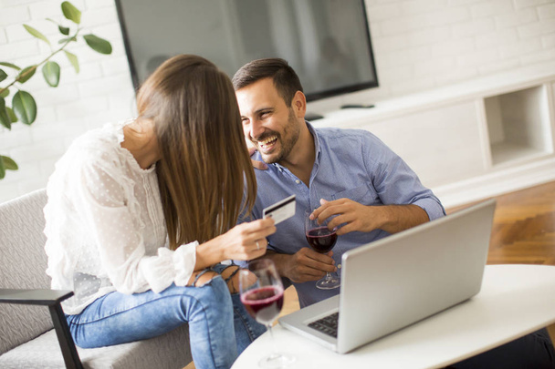 Cheerful couple searching internet and  shopping online - Photo, Image