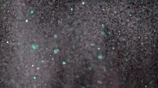 Realistyczne Glitter wybuchające na czarnym tle. - Materiał filmowy, wideo