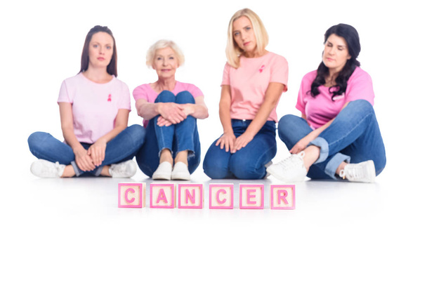 women in pink t-shirts with cancer inscription - Φωτογραφία, εικόνα