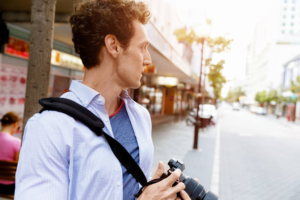 Male photographer taking picture - Fotó, kép