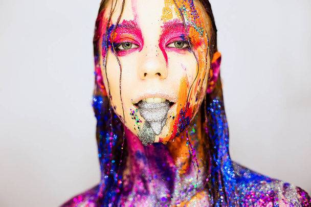 Close-up portrait of a young woman with art fashion creative glitter make-up - Foto, Imagen