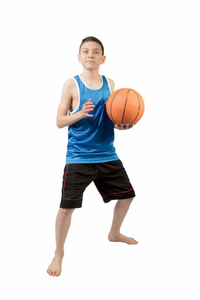 Young caucasian teenage boy with a basketball - Fotografie, Obrázek
