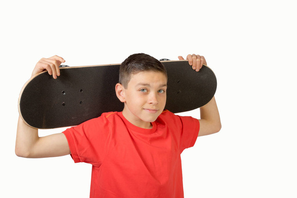 Young teenage caucasian boy with his skateboard - Fotoğraf, Görsel